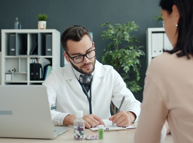 Matt Landry consulting a patient